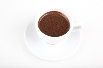 small cup of hot chocolate on a white plate in a white cup