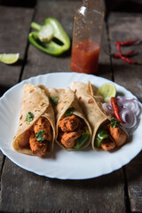 Tortilla wraps or chicken wraps served in a plate with use of selective focus. Close up.