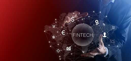 Businessman hold Fintech -financial technology concept.Business investment banking payment. Cryptocurrency investment and digital money. Business concept on virtual screen.