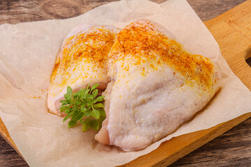 Raw chicken thigh with spices