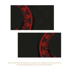 Preparing a business card with a place for your text and vintage ornaments. Business card design in black with red mandala patterns.