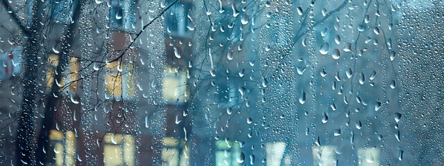 wet window city lights rain drops, abstract background autumn winter glow glass
