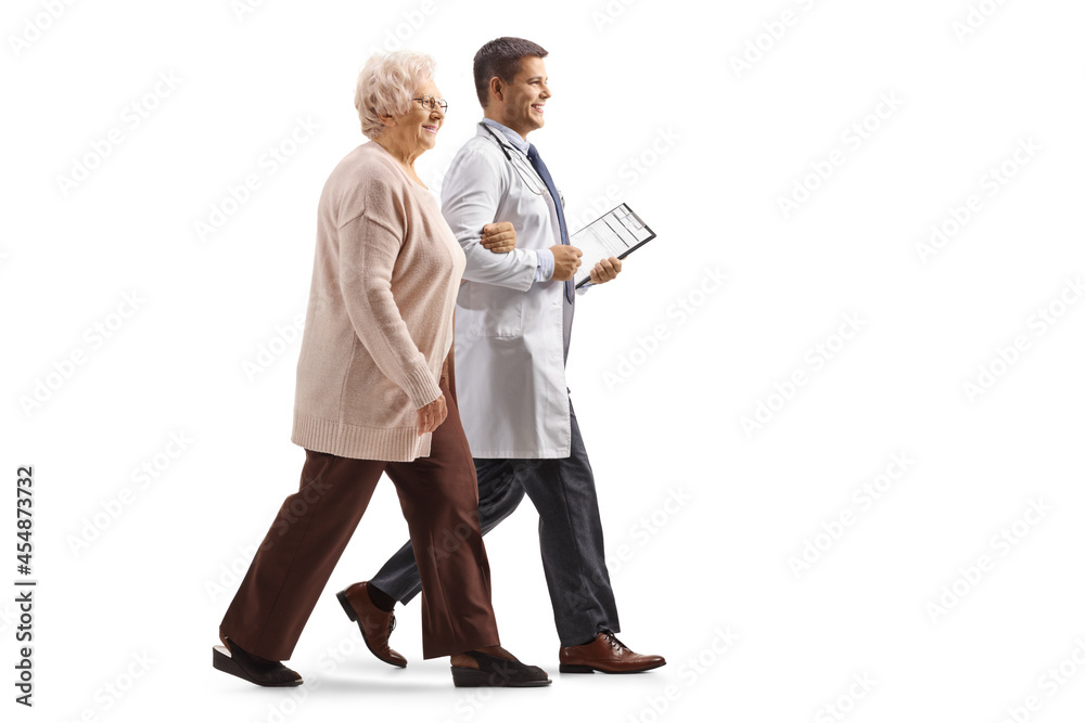 Canvas Prints Full length profile shot of a male doctor walking with an elderly woman