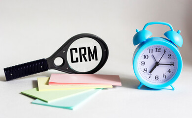 CRM, customer relationship management, loyalty program, repeat purchase frequency concept, CRM abreveatura magnifier on white background.