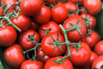 Pile of tomatoes and detail in a market
