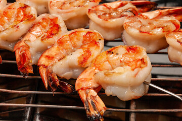 grilling shrimp on skewer on grill