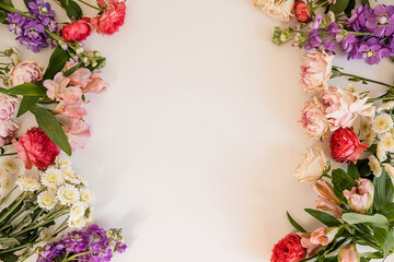 Aesthetic background with colourful flowers. Beautiful floral template composition. Round wreath frame with blank empty copy space mock up background. Flat lay, top view