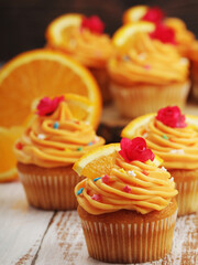 Cupcakes with orange icing on top	