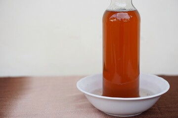 with water inside for protection from ants or insects will go into honey. Concept : Thai local wisdom of keeping food. Ants like sweetness of honey. Bowl for ants trap.