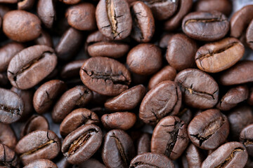 roasted coffee bean background macro close up, top view.
