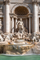 famous trevi fountain in rome with flowing water