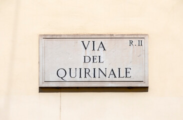 marble plate with Street name via Quirinale- engl: Quirinale street - at the wall in Rome