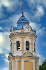 Fragment of the bell tower of a Christian church with a blue roof