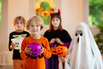 Obraz na płótnie Canvas Kids trick or treat. Halloween fun for children.