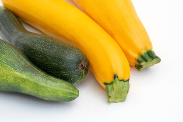 4 zucchini vegetables green and yellow on white background. Vegetarian food