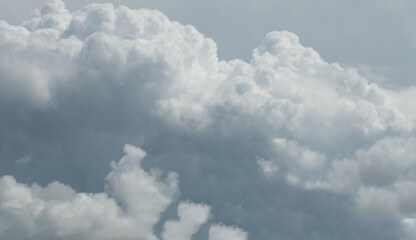 dramatic storm clouds piling up in the sky - copy space