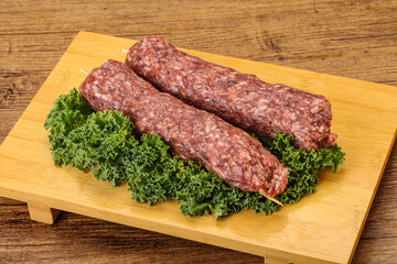 Raw minced beef kebab skewer