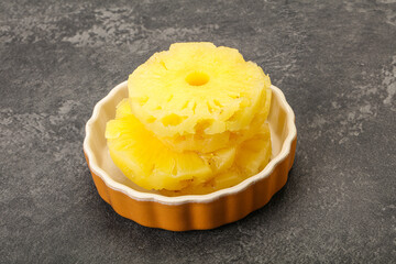 Sweet pineapple rings in the bowl