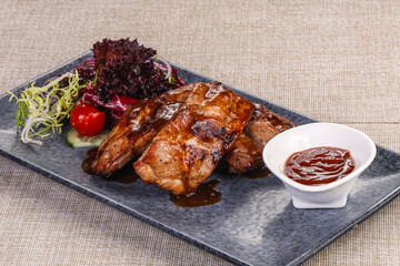 Grilled pork ribs with celery and carrot