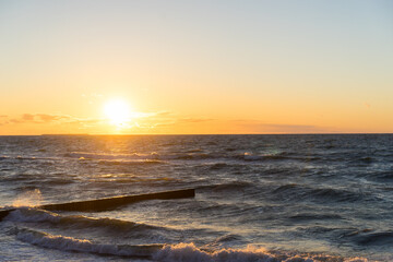 Beach sunrise and coastline with colorful cloud and blue sky.