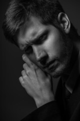 Young confident caucasian man in suit in black and white. Business concept