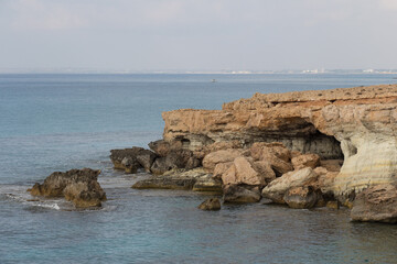 Rocky coastline with coast around Cape Greco, Cyprus.