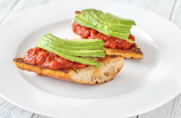 Bruschettas with tomato spread and avocado