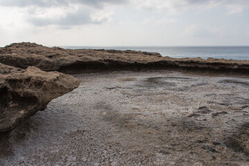 Crystallized salt in a rock hole after the sea water evaporated.