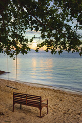 Nature in twilight period which including of sunrise over the sea and the nice beach. Summer beach with blue water and purple sky at the sunset.	
