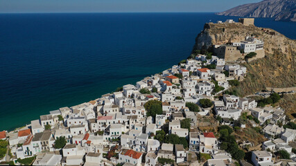 Obraz premium Aerial drone photo of breathtaking and picturesque main village of Skyros island featuring uphill medieval castle with scenic views to Aegean sea at sunset, Sporades islands, Greece