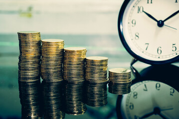 Gold coins stacks is representing riches and wealth management. Coin stack growing and find out the way to get a return on investment. Finance and money exchange investment as concept.	
