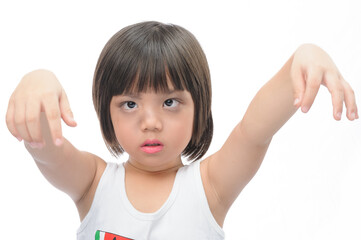 Happy asian kid on Halloween. A cute girl with black eyeliner put her hand up to make a scary expression and show emotion on her face with white background.