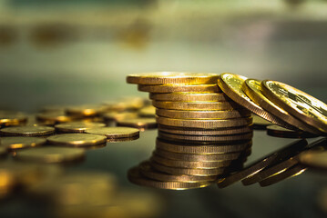 Gold coins stacks is representing riches and wealth management. Coin stack growing and find out the...