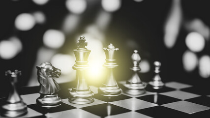 Closeup of chess characters on board games. to represent decision making in term of business strategy to find out the best solution to meet target objective and goal.	