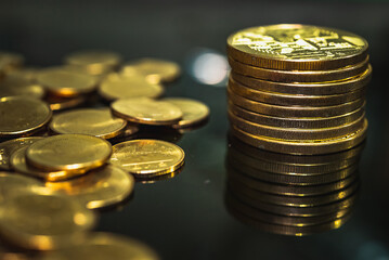 Gold coins stacks is representing riches and wealth management. Coin stack growing and find out the way to get a return on investment. Finance and money exchange investment as concept.	