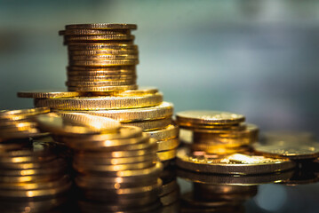 Gold coins stacks is representing riches and wealth management. Coin stack growing and find out the way to get a return on investment. Finance and money exchange investment as concept.	