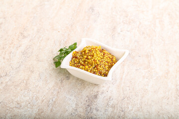 Grain mustard sauce in the bowl