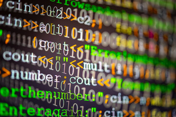 Abstract background of digital binary code of software. Programming software code on computer screen which develop by the programmer to solve the business requirement.