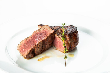 grilled beef fillet steak meat with rosemary isolated on white background