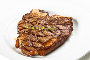 grilled beef fillet steak meat with rosemary isolated on white background