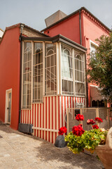 Fototapeta na wymiar House with red and white stripes located in Numana, Riviera del Conero, Marche - Italy