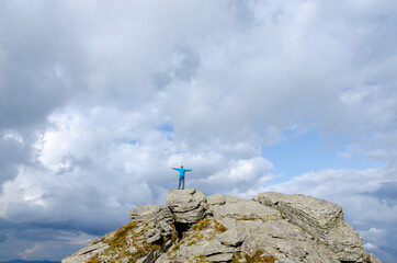 Fototapeta premium person on top of mountain