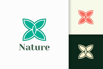 Flower logo in feminine and luxury style for health and beauty