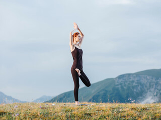 Athletic woman exercise gymnastics nature mountains