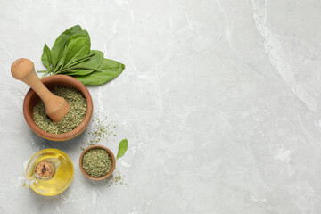 Flat lay composition with dried broadleaf plantain on grey marble table, space for text © New Africa