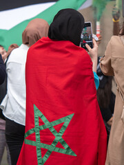 Girl with Moroccan Flag on her Shoulders during a Political Demonstration