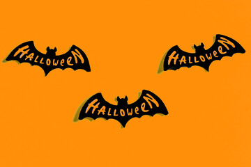 Ghosts and bats on a yellow and blue background. Halloween party