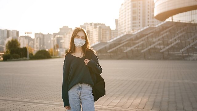 Portrait teenage student girl in wearing face mask going back to school after covid-19 lockdown  