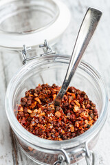 dried chilli flakes with salt in a glass jar