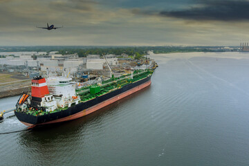 Crude oil tanker is uploading in the port terminal